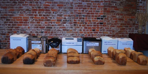 Seven Different Bread Makers On Table