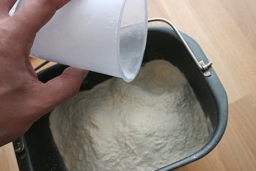 Pouring Flour In Bread Maker